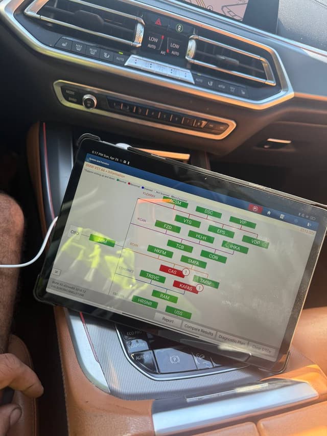 RoadPro technician running a diagnostic scan on a vehicle